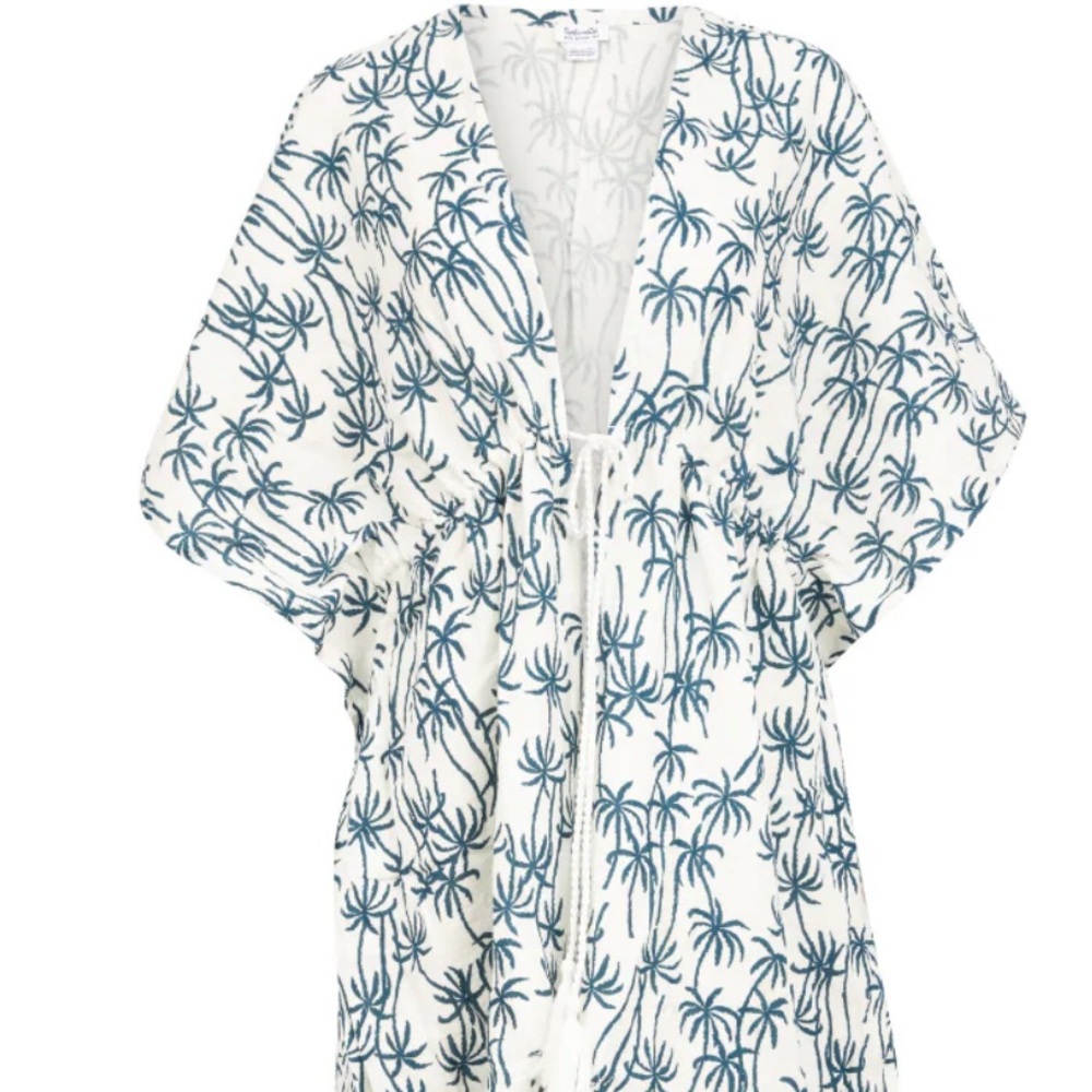 White and navy swim cover up with palm trees.